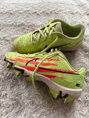 Youth boys Nike 2Y green and orange baseball cleats
